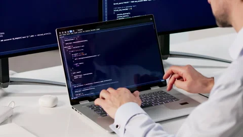 Man Coding On Laptop In Office, Focused Stock Footage 335458715