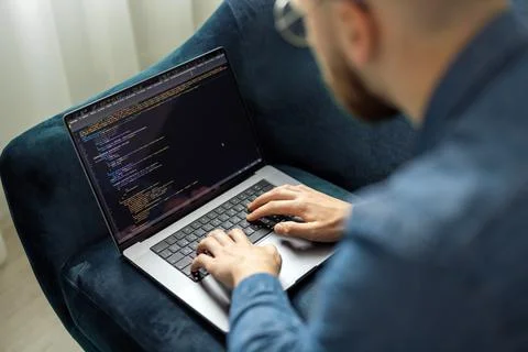 Man coding on laptop Stock Photos