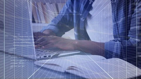 Man coding on laptop while checking notes, pausing and gesturing with grid Stock Footage 335739893