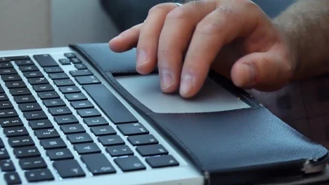 A man with a coffee bar, writes on a laptop Stock Footage 90876166