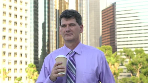 Man with coffee in downtown slowmo Stock Footage 201502952