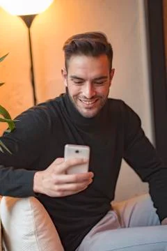 Man in a coffee shop using his cell phone Stock Photos