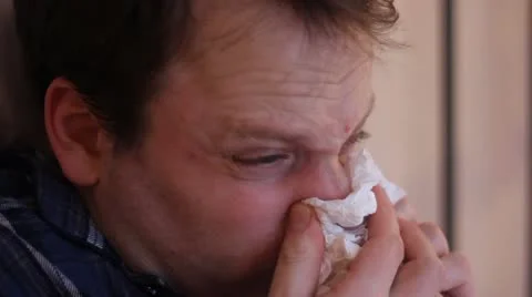 Man with cold blows nose and coughs Stock Footage 20600940