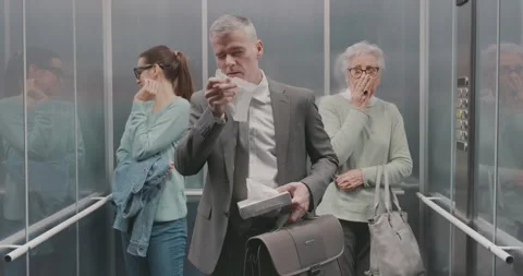 Man with cold sneezing in a elevator Stock Footage 306149686