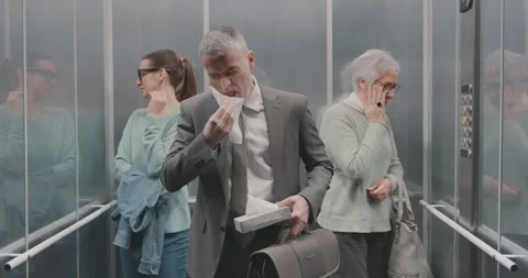 Man with cold sneezing in a elevator 库存影片 306149687