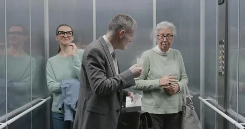 Man with cold sneezing in a elevator Stock Footage 306149716