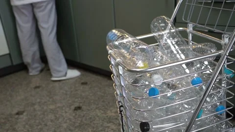 A man collecting plastic bottles for recycle in kitchen house02 Stock Footage 137158439