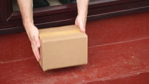 Man Collects Delivery Parcel Package At Front Of Home, 4K Stock Footage 133997810