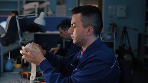 Man collects a microscope Stock Footage 104932440