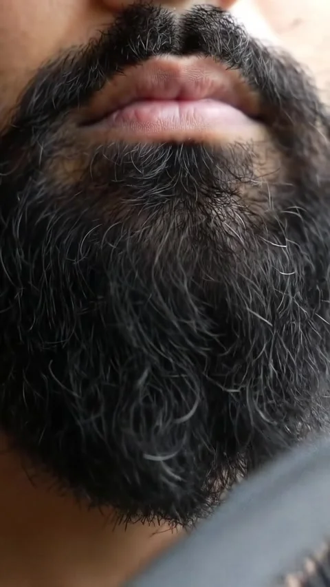 Man Combing Beard and Oil Droplet Close Up – Cinematic Slow Motion 4K Ultra HD Stock Footage 315081047