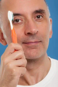 Man combing his eyebrows Stock Photos