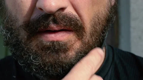 A Man Combing His Mustache And Beard With a Comb. Video stock 130315619