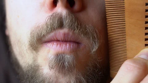 A man combing his mustache with comb Stock-Footage 124095970