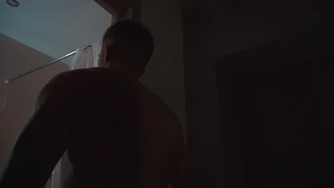 Man comes into the bathroom Video stock 104898485