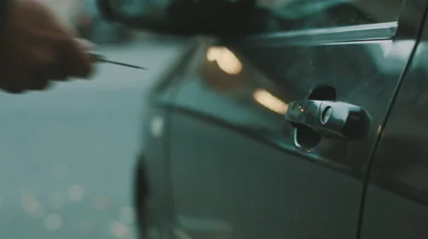 Man comes to the car, opens the door and sit insides Vídeo Stock 68147917