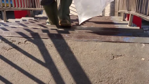 A man comes down the stairs Stock Footage 258817367