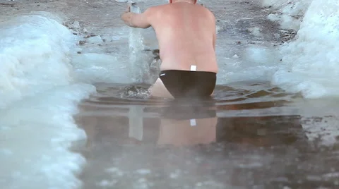 Man Comes Into Ice Water Stock Footage 61811208