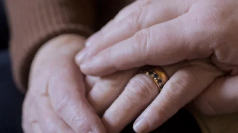 Man comforts elderly woman Stock Footage 35147599