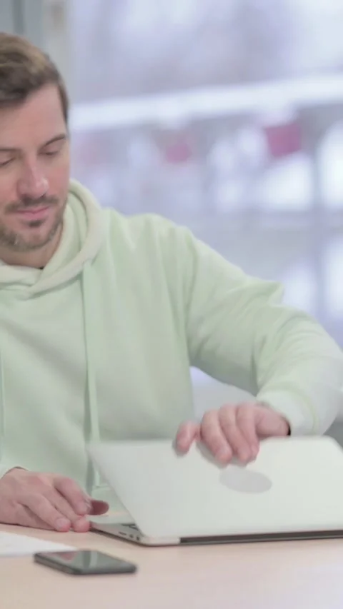 Man Coming Back to Office and Opening Laptop, vertical video Vídeo Stock 329104891
