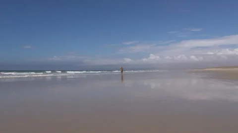 Man coming running at the beach Stock Footage 20542964