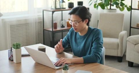 Man coming up with a solution while working on laptop Stock Footage 145292135