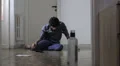 A man commits suicide with a gun leaving a note and a blood stain on the wall HD Footage