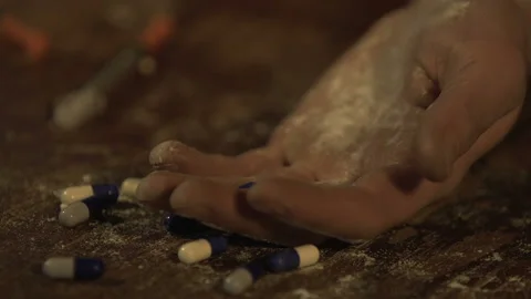 Man committing suicide, hand full of pills falling on floor closeup overdose Stock Footage 87249214