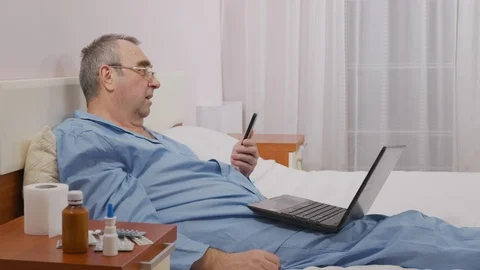 A man communicates with relatives during illness during an illness, isolation Stock Footage 126623361
