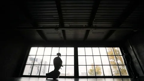 A man communicates with a robot, presses a plastic mechanical arm to the robot Video stock 80419473