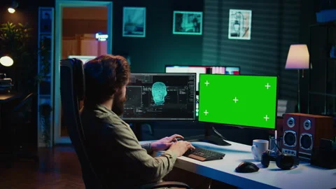 Man communicating with artificial intelligence through green screen computer Stock Footage 266951797