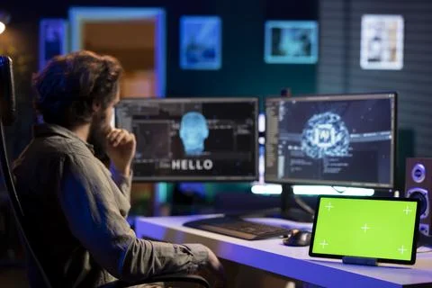 Man communicating with artificial intelligence through isolated screen device Stock Photos