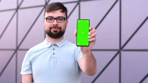 Man communication device digital internet a smartphone with green screen chroma Stock Footage 167825791