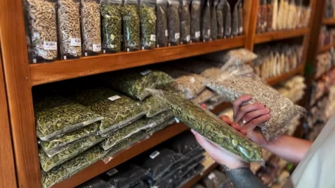 A man compares carefully pre packed seeds and chooses the best ones Stock Footage 278445558