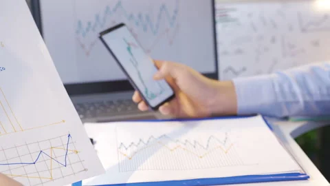 Man comparing and analyzing digital and drawn graphics. Stock Footage 220662286