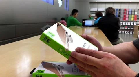 Man comparing two Techlink recharge ultrathin power for iphone 6 Video stock 62913562