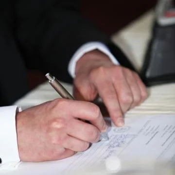 Man completeing a questionnaire Stock Photos