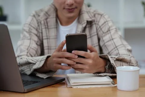Man Completes KYC using an online banking app in order to open a digital savings Stock-Fotos
