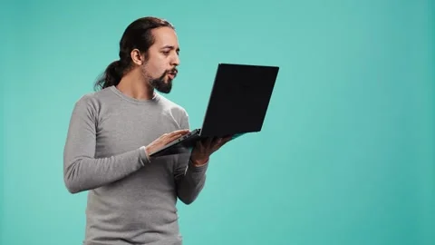 Man composing email, typing on laptop keyboard, excited to log off after work Stock Footage 319471366
