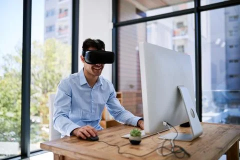 Man, computer and glasses for virtual reality in office with smile for coding 스톡 사진