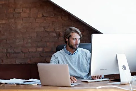Man, computer and remote work in home office, reading or review research for Stock Photos