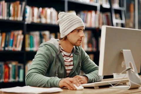 Man, computer and study in college library for programming course, project and Foto stock