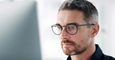 Man, computer and thinking at office with review, proposal or spectacles for Stock Photos