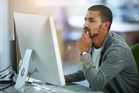 Man, computer and thinking as web designer in office for software programming Stock Photos