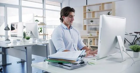 Man, computer and typing in office for business, administration and financial 写真素材
