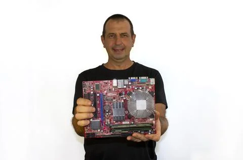 Man with a computer board, programmer, computer technician Stock Photos