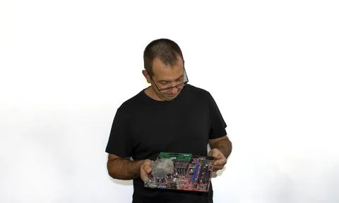 Man with a computer board, programmer, computer technician 스톡 사진