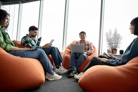 Man with computer brainstorming with colleagues at workplace 스톡 사진