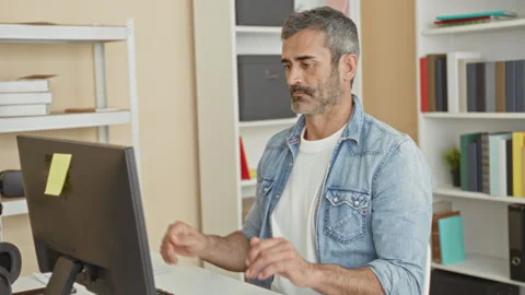 Man at computer with hands in meditation pose and eyes closed in studio wor.. Stock Footage 339170037
