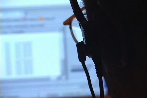 Man At a Computer with a Headset On Stock Footage