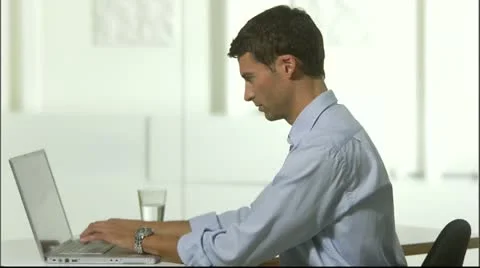 A man with a computer in an office, Stockholm Stock Footage 11298031